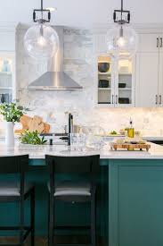 Instead of opting for white, be brave by choosing a moodier hue like sage green to saturate your kitchen with. The Best In Dark Green Kitchen Trends Town Country Living