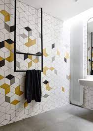 You will be able to differentiate the advantages in style and function. Stunning Modern Home With Unique Details Design Milk Yellow Bathroom Decor Bathroom Tile Designs Modern Bathroom Tile