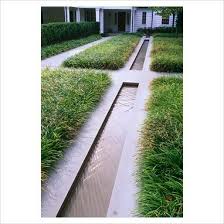 Contemporary Water Rill With Grasses Paths And House In Background The Odrich Garden Green Water Features In The Garden Small Water Features Water Features