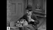 Charlie Chaplin saves Scraps from a wild pack of dogs - From "A ...