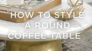 A good rule of thumb is to create groupings in a triangular shape for visual interest. How To Style A Round Coffee Table Youtube