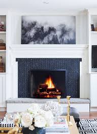 Black And White Mosaic Tile Fireplace So Fresh So Chic The Iconic Herringbone Pattern Herringbone Interiordesign Sofreshandsochic Classic Fireplace Fireplace Surrounds Fireplace Design