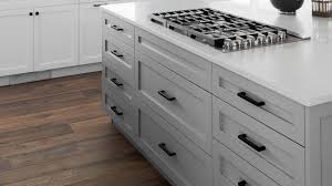 It is not unusual to see slab drawer fronts in kitchens with shaker cabinets. White Shaker Cabinets Lakehouse Remodel Highcraft Cabinets