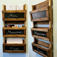 This slim magazine and book rack is the ideal solution for quick and easy access to all of your favorite reading materials. Reclaimed Pallet Wood 3 Pocket Vertical Wall Organizer With Chalkboard Mail Holder File Holder Magazine Rack Of Diy Pallet Projects Pallet Diy Upcycle Home