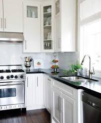 Black And White Granite Countertops With White Cabinets Laurel Ridge Homes White Kitchen Cabinets Black Granite Countertops Subway Tiles And Polishe With Images Kitchen Inspirations Kitchen Remodel Black Granite Countertops