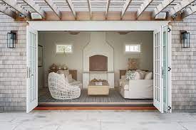 The pool house design connects main home interiors with a swimming pool, creating a roofed stone patio beside the outdoor swimming pool. 15 Pool House Ideas For Your Ultimate Staycation