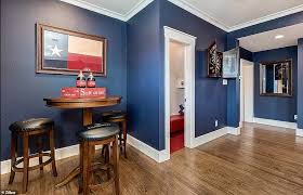 The cowboy modern theme infuses this room, with the sleek cowhide rug softening the original flooring, carole says. Red White Blue Texas House Covered In State Flags Is Listed For 529 000 On Zillow Daily Mail Online