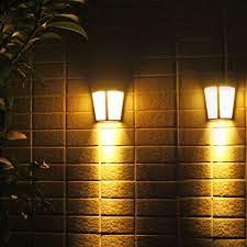 Outdoor solar lights do everything from accenting your beautiful landscape work to improving the safety and security of your home to simply lighting the path to your front door. Eeekit 2 1 Pack Solar Power Led Lights Outdoor Waterproof Wall Lamp Wall Mounted Solar Lights Solar Night Security Lamps For Front Door Outside Wall Back Yard Garage Garden Fence Driveway