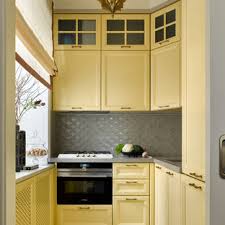 The primary colors match the minimalistic décor of the space this welcoming kitchen features a wooden island with deep brown cabinets that stand out against the black countertop and darker cabinetry. 75 Beautiful Kitchen With Yellow Cabinets And Gray Countertops Pictures Ideas June 2021 Houzz