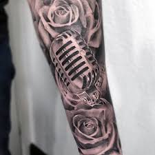 This type of tattoo drawing designs is usually worn by most rock band members. Amazing Forearm Sleeve Guys Shaded Rose And Microphone Tattoo Design Ideas Tattooideasforearm Muzik Dovmeleri Erkek Dovmeleri Dovme Tasarimlari