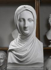 Venezia" is a marble sculpture by Larkin Mead, an American sculptor in  1865. Mead likely carved this figure in resemblance to his wife, rising  from a seafoam bodice. She is meant to