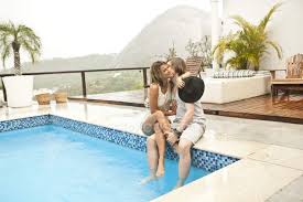 At river pools, we have done our own fiberglass pool rooftop. Young Couple Kissing At Rooftop Swimming Pool Rio De Janeiro Brazil Vacation Young Man Stock Photo 166085606