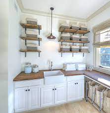 The simplest yet the coolest wall art idea for laundry room is a laundry room wall sign. Eye Catching Laundry Room Shelving Ideas