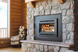 Gas insert fireplace with a traditional log set and millivolt system. Mountain Hearth Patio Fireplace Sales Service Installation