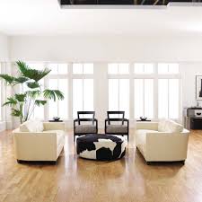 Trying to mix contrasts between similar. White Walls Light Wood Floors And Cream Colored Furniture Make This Space Bright Clean And Modern Furnitu Light Wood Floors White Walls Interior Wall Design