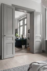 When your space is dominated by brown shades or wooden colors, the combination of wooden color doors and white interior trim is the one to consider. L Art De Presenter L Art La Virgule Home Door Design French Doors Interior Grey Interior Doors