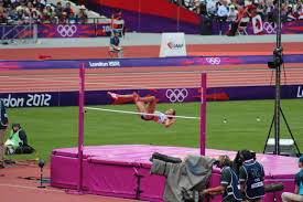 Boy compete in the high jump. Official Rules For The Olympic High Jump