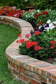 Brick Flower Bed Border Doubling As A Casual Bench Convenient When Planting Small Retaining Wall With Brick Brick Garden Garden Flower Beds Brick Flower Bed
