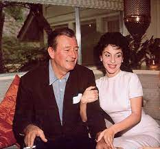 John Wayne at home with his wife Pilar Wayne and their daughter Aissa in  Encino, California, 1958. Photos by Bernie Abramson JohnWayne