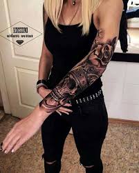 A full sleeve of a plague doctor in front of a dark cathedral. 13 Fullsleeve Tattoo