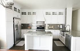 Instead of using 36 or 42 high wall cabinets on the stove wall, the couple stacked four 30 wide x cabinet doors have an enamel finish as slick as glass. Stacked Cabinet Kitchen Makeover Pneumatic Addict