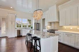 Best way to update your kitchen cabinets. White Kitchen Island With Gray Granite Countertops Transitional Kitchen White Granite Countertops White Gloss Kitchen Grey Granite Countertops