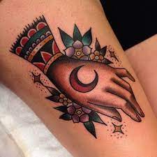 Every client is treated as an equal, and given our full respect and attention. Hand With Moon And Forget Me Knots Traditional Tattoo Gastown Cutestcustomers Hand Moon Flowers Traditional Hand Tattoo Traditional Tattoo Tattoos