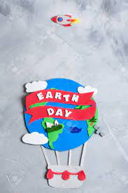 Design an attention grabbing poster for your next earth day promotions! Paper Craft Earth Globe Rocket Handmade On Gray Concrete Background Stock Photo Picture And Royalty Free Image Image 76661729