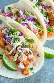 Fiery stewed chicken and smoked andouille sausage, rice, tillamook cheese, sour cream, corn salsa. Seared Salmon Tacos With Honey Lime Slaw And Sriracha Ranch