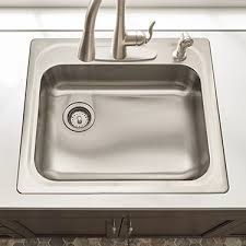 The adhesive applies under the lip of the sink, which is dropped into place and adjusted to its proper location. How To Install A Drop In Sink Self Rimming Sink Installation