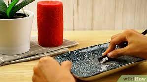 Make a weak vinegar/water solution with one part vinegar and at least 15 parts water in the bucket. 5 Ways To Remove Candle Wax Wikihow