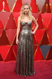 Jennifer lawrence has responded to the uproar surrounding a photo of herself in a revealing dress jennifer wore a versace dress for the photocall. Jennifer Lawrence Stuns In Gorgeous Silver Gown At Oscars Nice Dresses Oscar Dresses Red Carpet Dresses