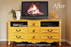 You can decorate with distressed pieces in even the most luxurious of spaces. Vintage Dresser Into Media Center No 2 Pencil