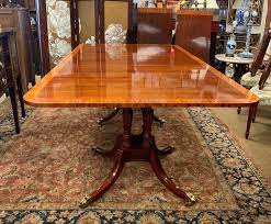 The dining table has decorative vertical slats around the apron and a black metal base and mdf with a veneer top. Baker Furniture Mahogany Dining Room Set Table And Ten Chairs At 1stdibs
