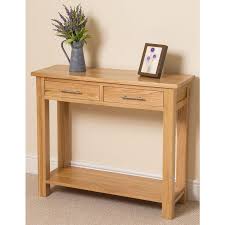 Wayfair offers console and sofa tables that have a lacquered finish on the wood, along with naturally textured pieces. Oslo Solid Oak Console Table Oak Furniture King