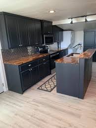 With the recent rise in popularity of bright kitchen cabinets, dark butcher block countertops can make for a great counter choice for a bold, contrasting look. Black Cabinets With Butcher M A D Cabinets Woodwork Facebook