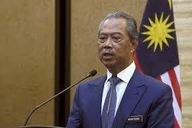 An electronic shop staff wearing a face mask watches live broadcast of malaysian prime minister muhyiddin yassin speak at a shopping outlet in kuala lumpur, malaysia, monday, aug. Pm Warns Of Possible New Lockdown Mulls Mandatory Face Mask Use The Mole
