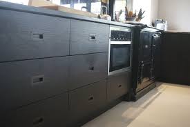 Stained Black Oak With Recessed Bronze Handles Black Kitchens Black Kitchen Handles Oak Cabinets