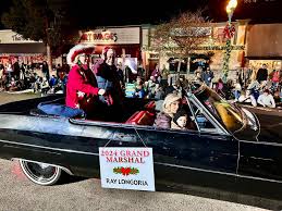 The 46th Annual Seal Beach Christmas Parade featured Grand Marshall Ray  Longoria, District Governor Scott Quinlan and Lions President Mary Hollen.