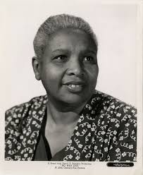 Scene from Oscar Micheaux's film, GOD'S STEP CHILDREN (1938) featuring  Laura Bowman and Ethel Moses. Bowman played the role of 'Aunt Carrie' and  Moses played two roles in the movie