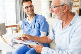 Nurse providing home healthcare to elderly patient