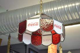 The lamp itself has the original globe light cover inside and features a long chain and plug. Old Coca Cola Hanging Light Sold