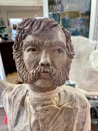 Music conductor being sculpted in clay