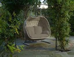 The seat of a swing may be suspended from chains or ropes. Hammocks And Swing Seats Hayes Garden World