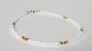 Bead Bracelet Clipart Black And White A Beaded Anklet Featuring The Colours Of The Rastafari Movement A Simple White Bead Anklet With Red Yell Beaded Anklets Pearl Jewelry Design Ankle Bracelets