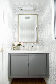 It's the one room in the home where you should take full advantage of experimenting with bold colors and patterns. Black And White Powder Room Wallpaper With Gray Floating Washstand Transitional Bathroom