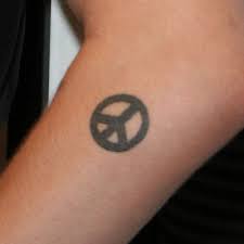 A tattoo that runs from the wrist down. 27 Amazing Peace Tattoo Ideas With Meanings Body Art Guru