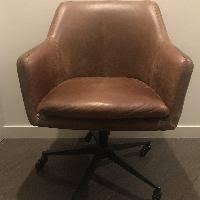 Molasses colored sot leather, with swivel base. West Elm Helvetica Office Chair Aptdeco