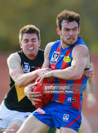 Luke Tynan of Port Melbourne is tackled by Ben Speight of Werribee... News  Photo