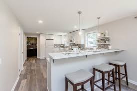 The ideal upper cabinet height is 54 inches from the ground, but not everywhere. White Cabinets W Bar Height Peninsula Modern Kitchen New York By Winbourne Building And Design Houzz Uk
